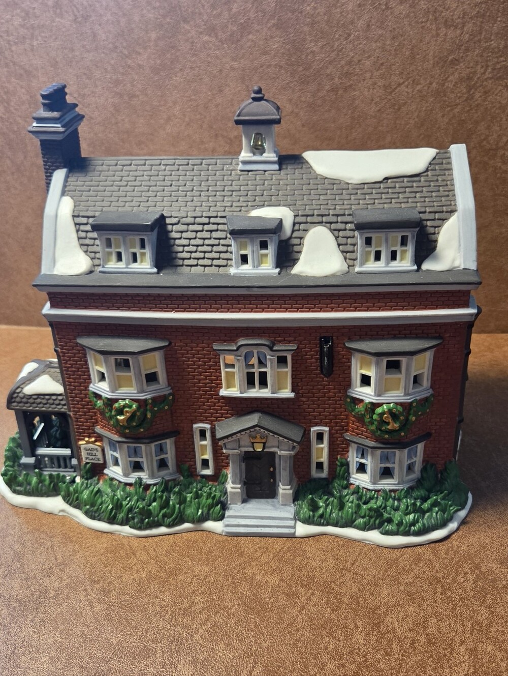 Holiday Red Brick Decorative House with Snow Accents